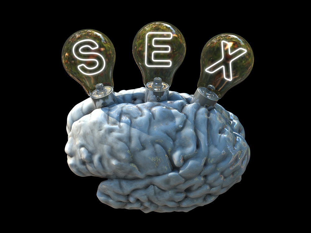 A brain with protruding lightbulbs that spell out the word "SEX."