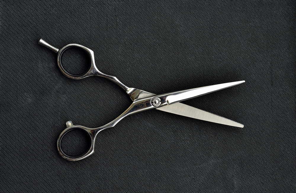 Vasectomy, represented by scissors image