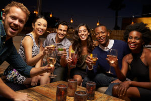 Group drinking beer at table