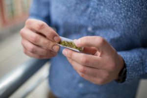 Man rolling a joint